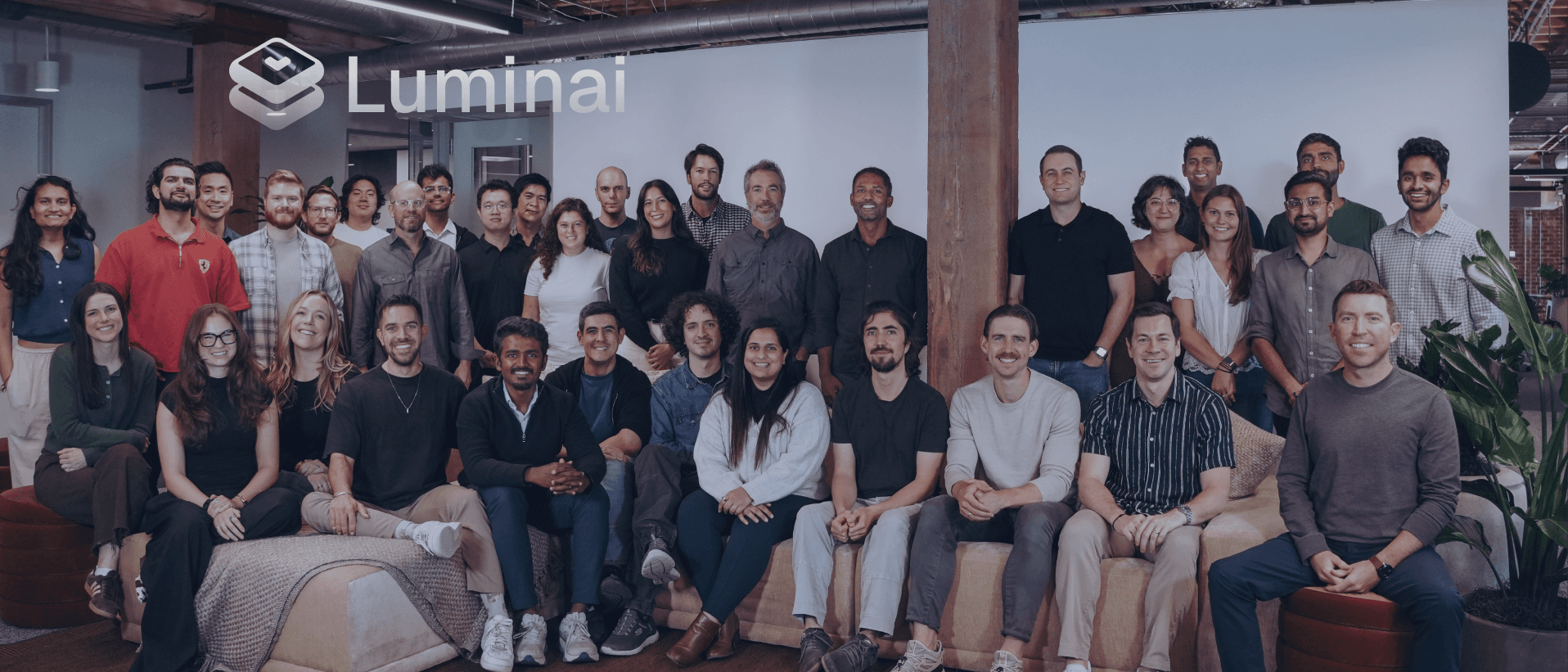 The Luminai team with a blue tint and Luminai logo